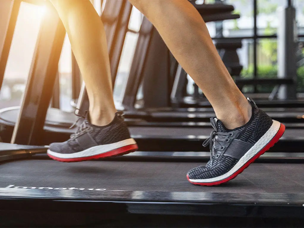Athlete running on treadmill in properly fitted athletic shoes